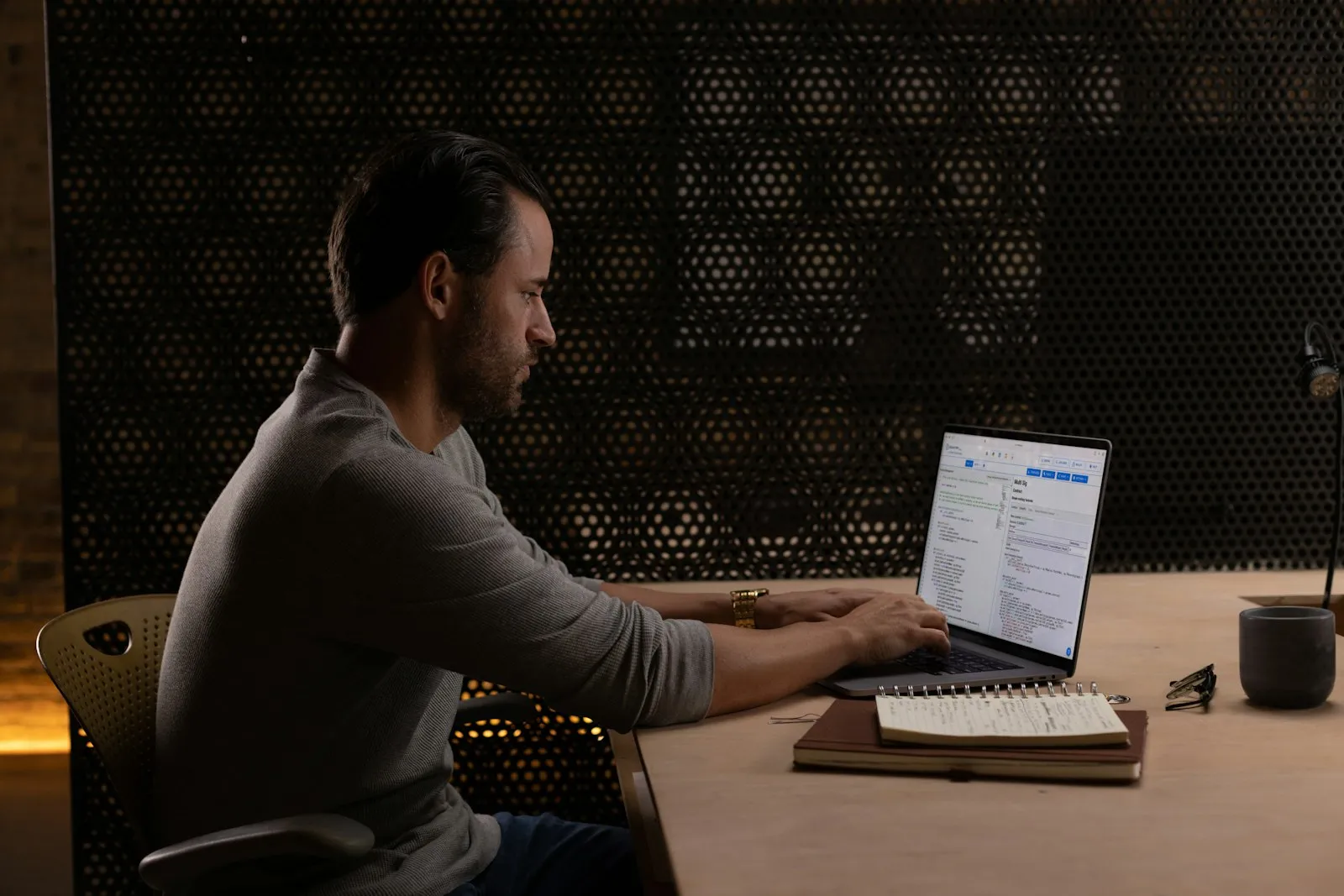 An accountant reviewing figures on a laptop in a quiet office